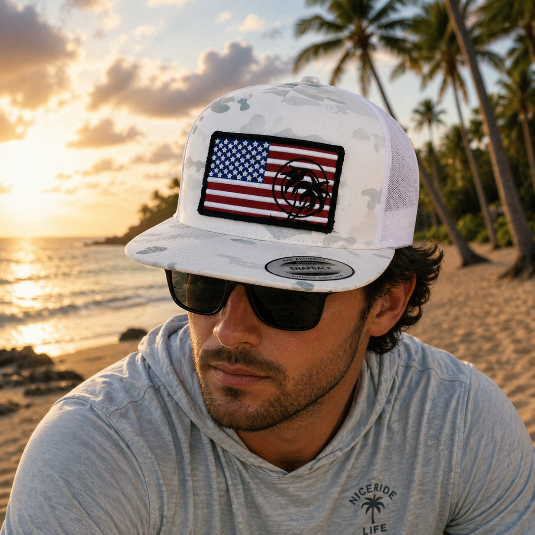 True American Collection hat featuring an embroidered American flag design on a camouflage background.