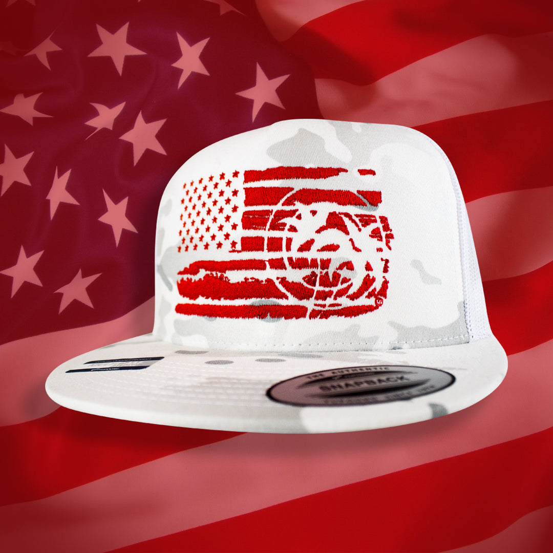 True American Collection hat featuring an embroidered American flag design on a camouflage background.