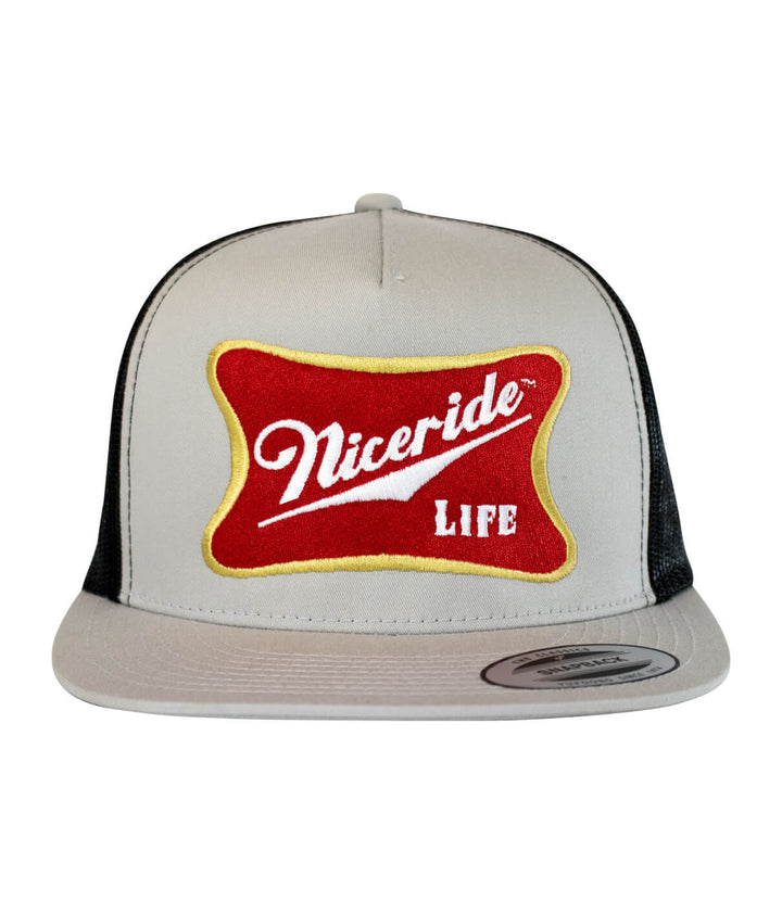 Biscuit Trucker Hat featuring NICERIDE design and black classic palm logo, perfect stylish hat for casual wear.
