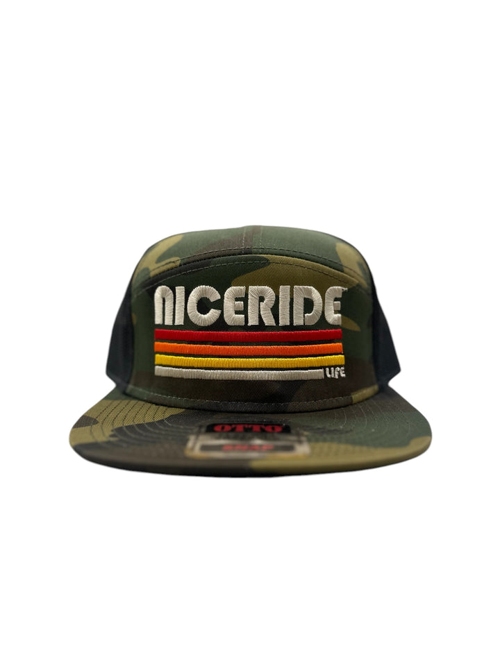 7 Panel Trucker Hat by NICERIDE in camo featuring embroidered logo, perfect trucker hat for casual wear.
