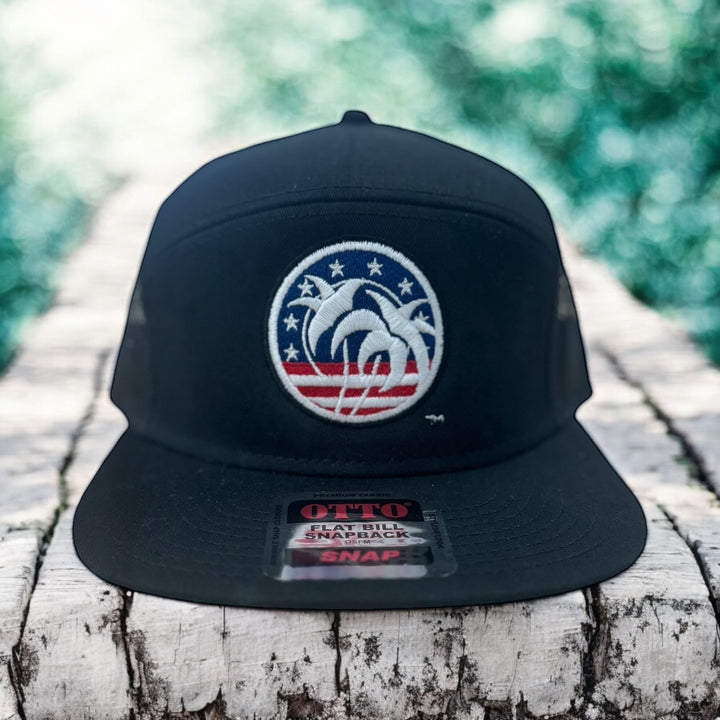 Spirit of 76 OTTO Unisex 7 Panel Trucker Hat with palm and American flag design on a black cap.