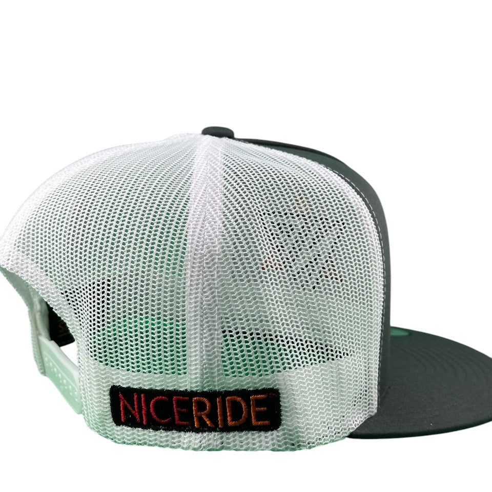 Back view of NICERIDE Wall unisex trucker hat showing mesh design and embroidered logo.