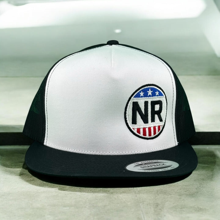 NICERIDE NR logo trucker hat with white front and black mesh panels.