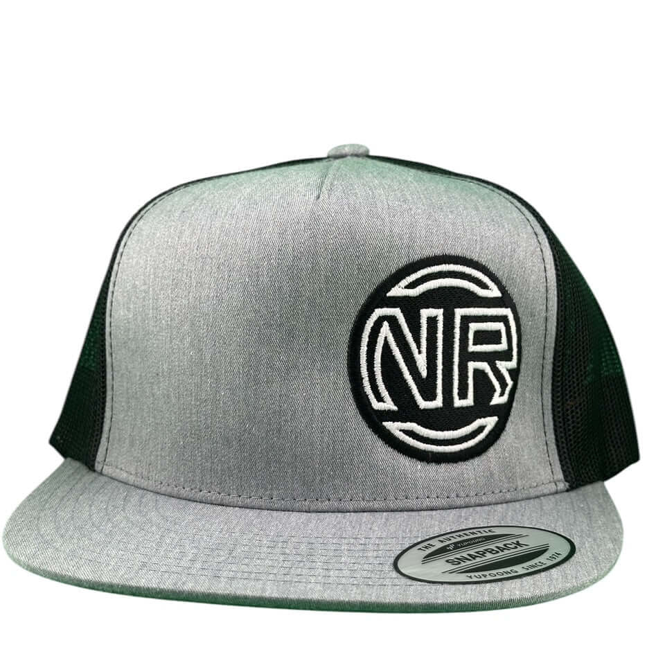 NICERIDE Inner Circle unisex trucker hat with embroidered NR logo on charcoal grey and black mesh.