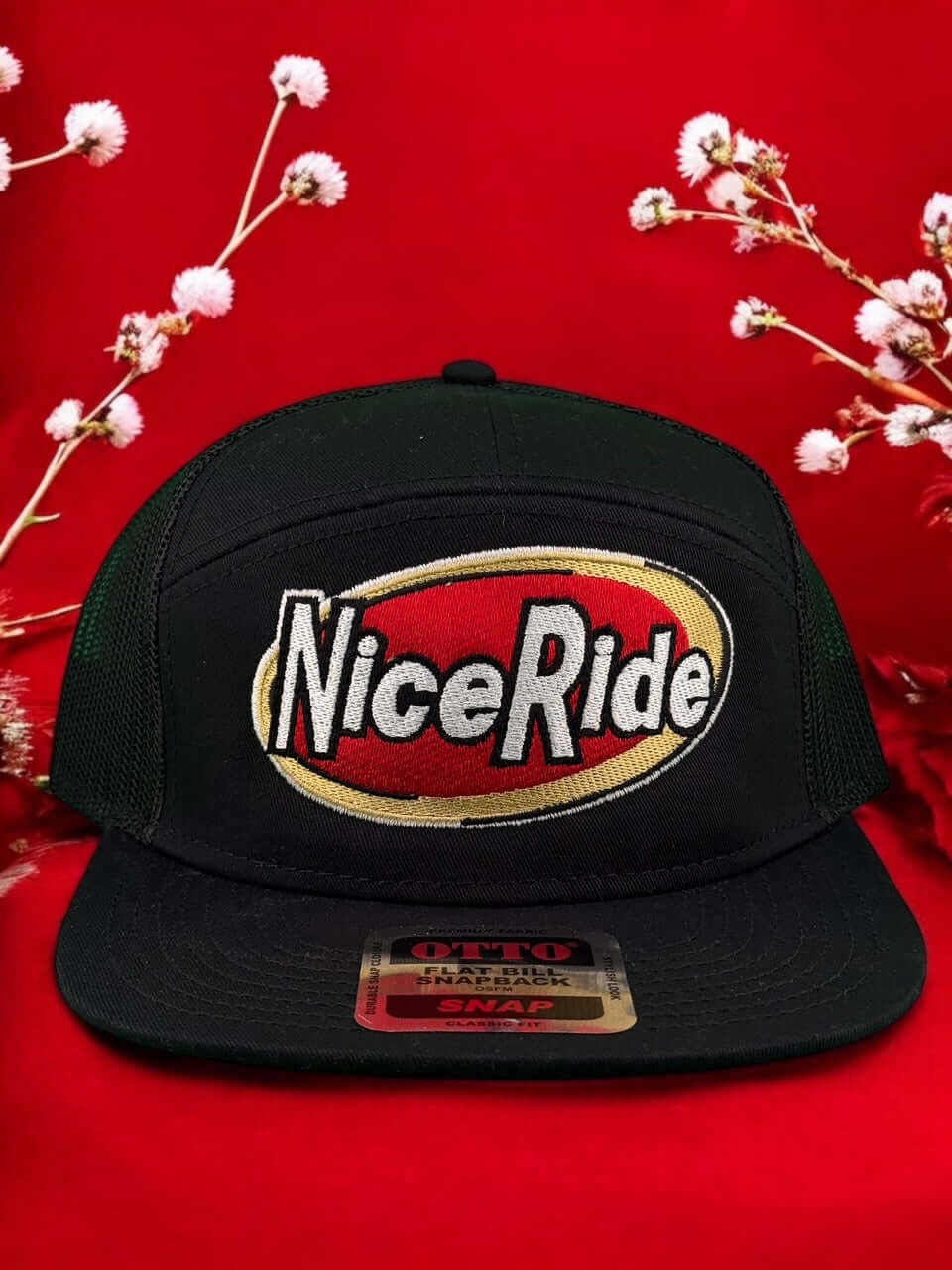 NICERIDE Meow Otto seven-panel adjustable hat on a red background with floral accents.
