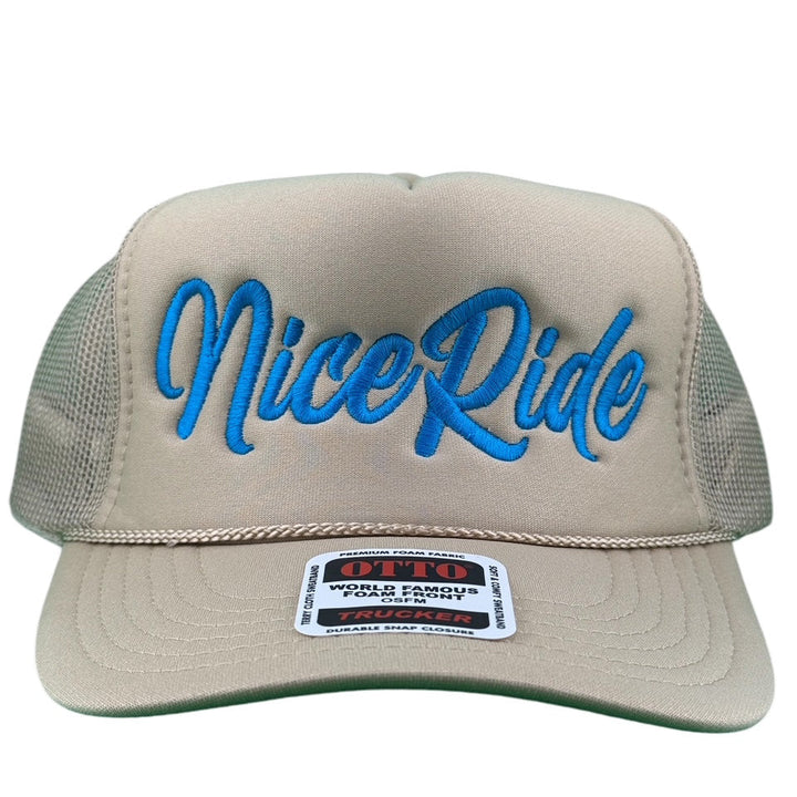 "Signature" Foam Trucker Hat featuring NICERIDE logo in blue on a beige front panel.