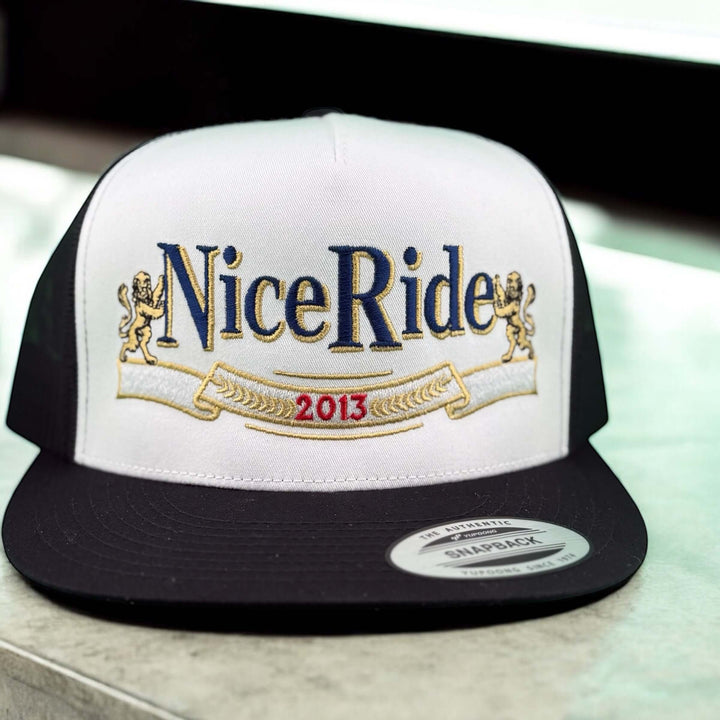 Nice Ride snapback trucker hat featuring embroidered logo and year 2013 on the front in white and black design.