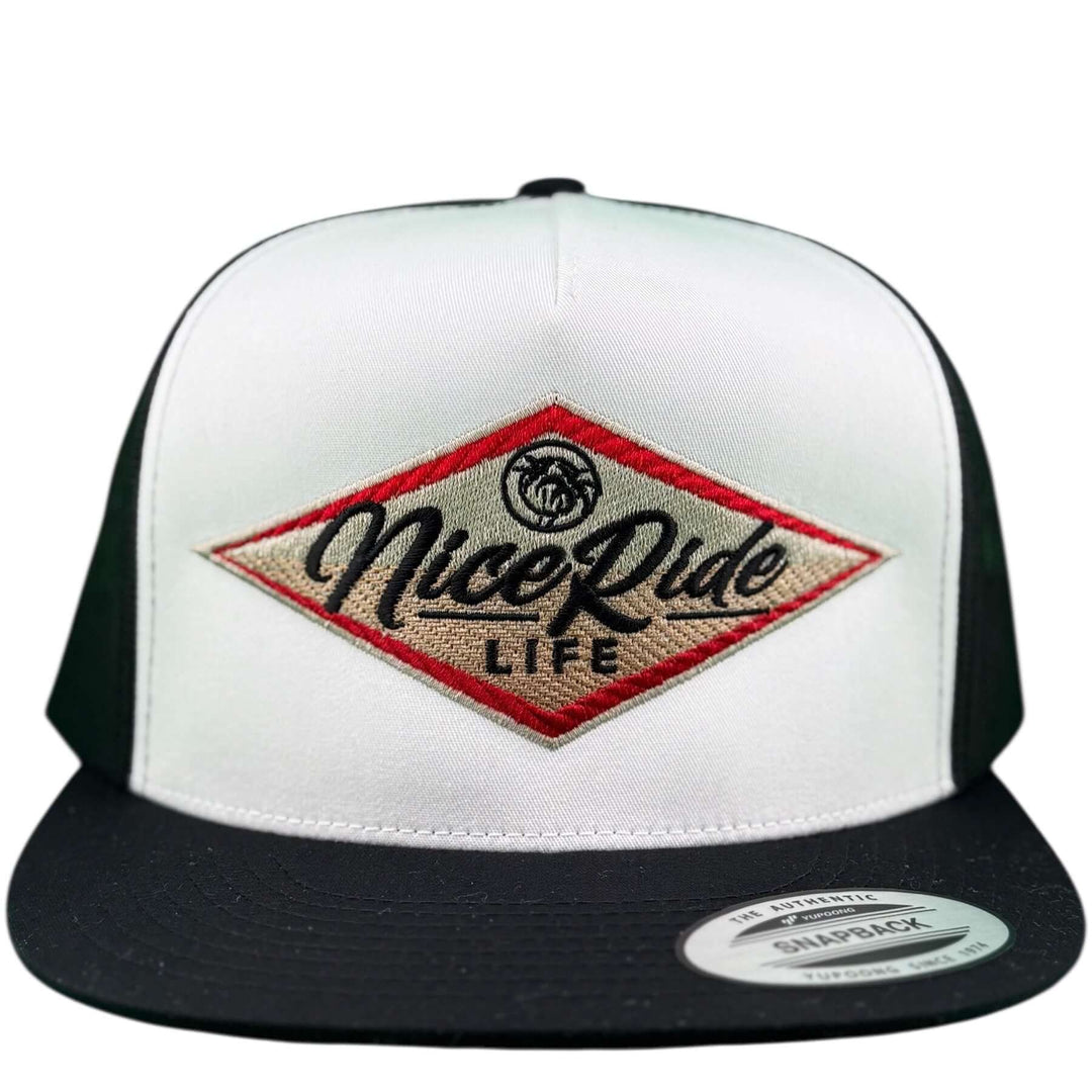 NICERIDE South Point unisex adjustable trucker hat in white and black with embroidered logo