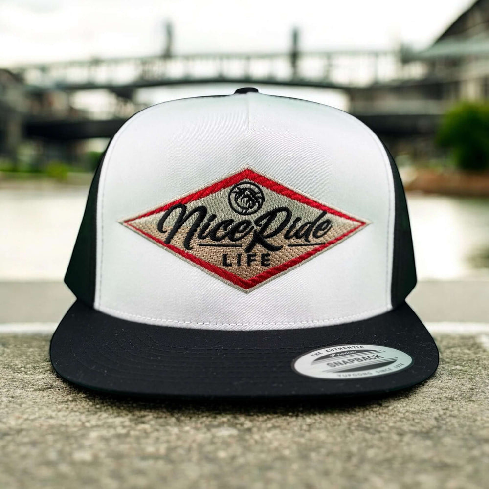 NICERIDE South Point unisex adjustable trucker hat with red and black logo, perfect for coastal style and everyday wear.