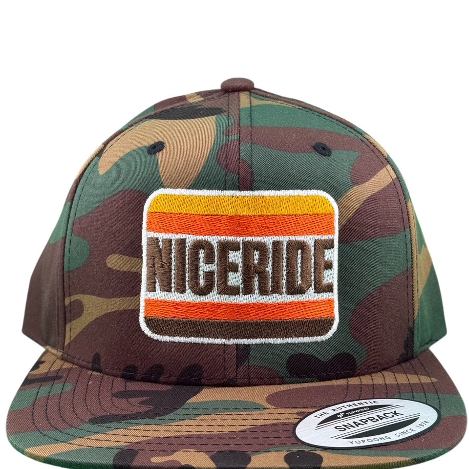 NICERIDE 'Friar' unisex adjustable trucker hat in camo design with embroidered logo on front.