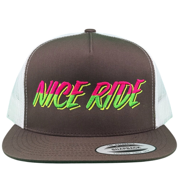 NICERIDE Slump Buster 6006 unisex adjustable trucker hat with bold pink and green logo on brown fabric.