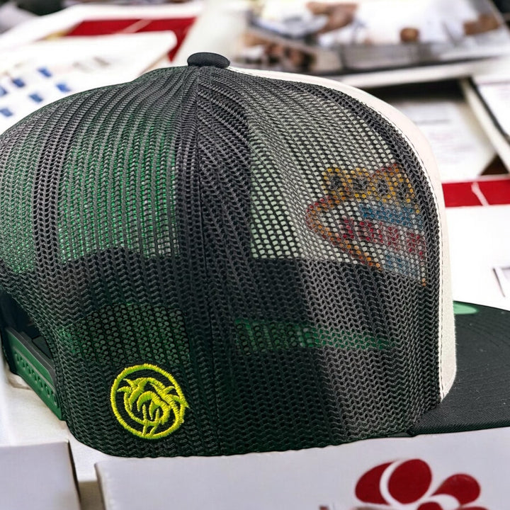 Back view of the NICERIDE "STRIP" unisex adjustable trucker hat showcasing the embroidered logo and mesh design.