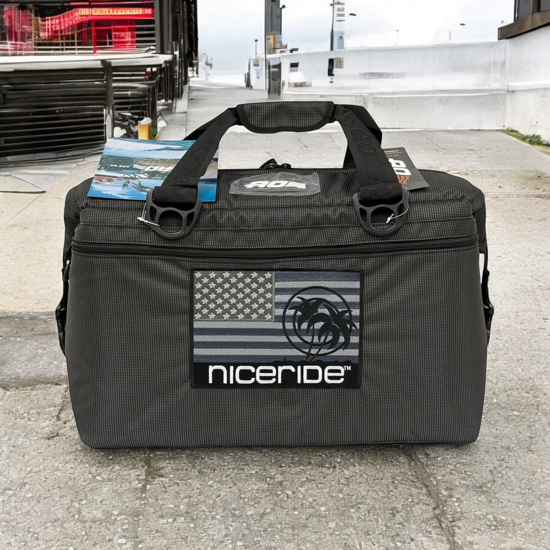 NICERIDE Strong soft-sided cooler in black with embroidered logo and American flag design, perfect for outdoor adventures.