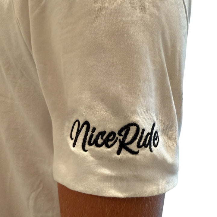 Close-up of NiceRide embroidered logo on the sleeve of a white men&