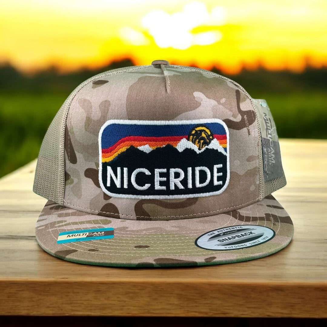 Glacier 6006 Unisex Tan camo Adjustable Trucker Hat featuring bold NICERIDE logo and mountain design.