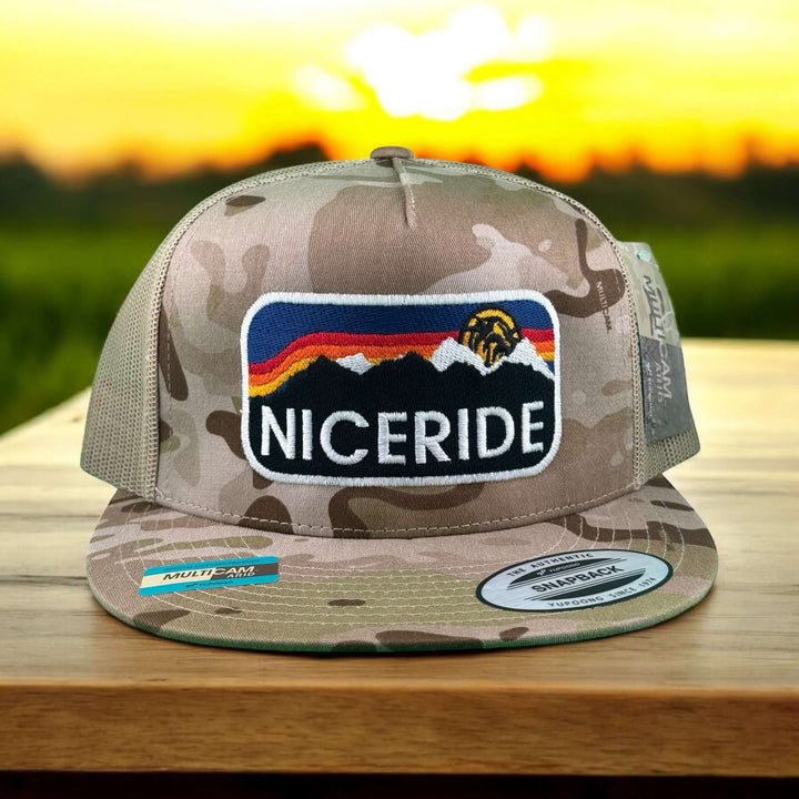 Glacier 6006 Unisex Tan camo Adjustable Trucker Hat featuring bold NICERIDE logo and mountain design.