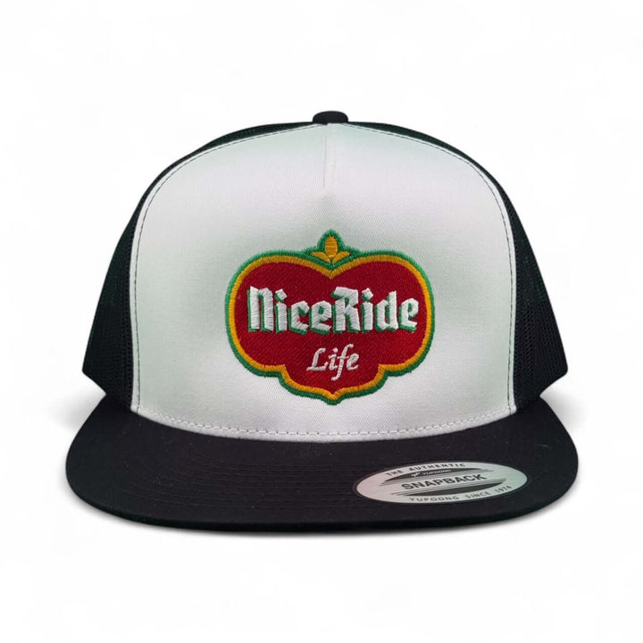 Dented unisex trucker hat featuring embroidered NiceRide logo in vibrant colors on a black and white snapback style.