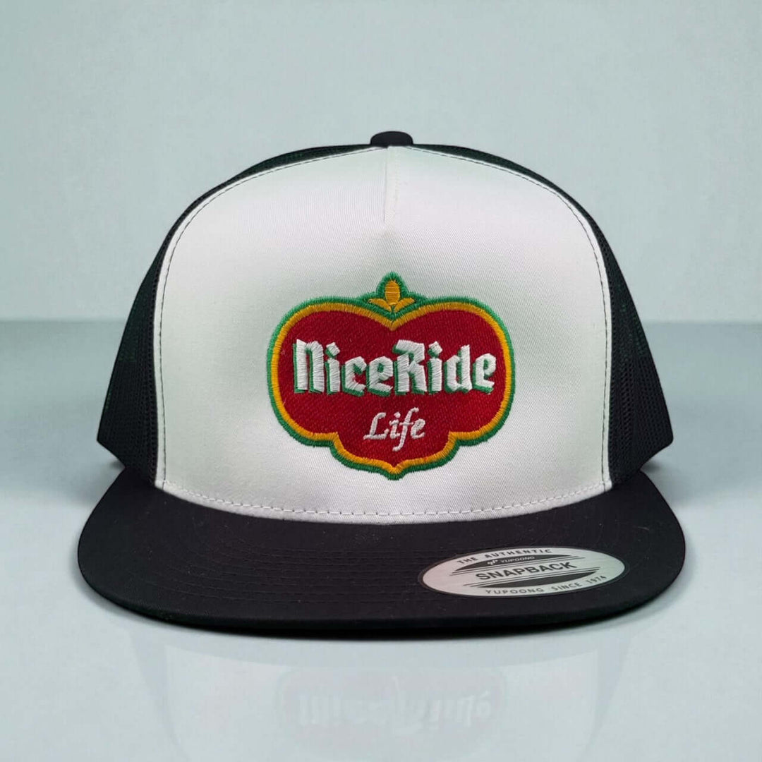Dented unisex trucker hat featuring NiceRide Life logo in red and green, stylish snapback design.