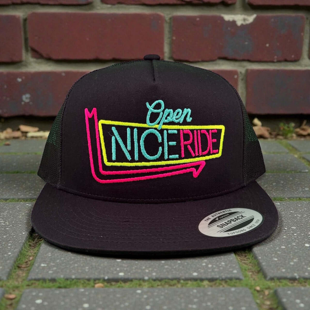 NICERIDE "24 Hour" unisex adjustable trucker hat with colorful embroidered logo on front.