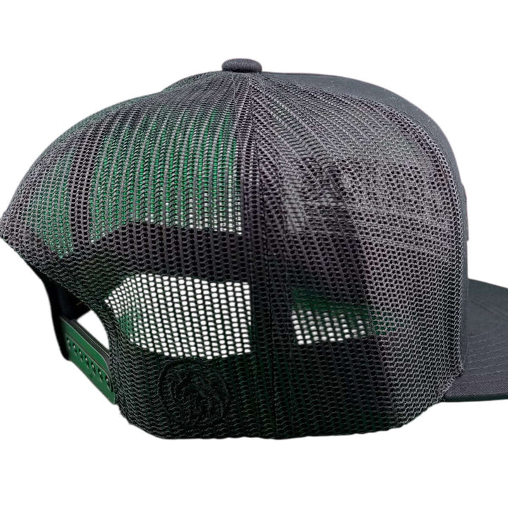 Back view of the Trigger black puff trucker hat showcasing mesh design and adjustable snapback closure.