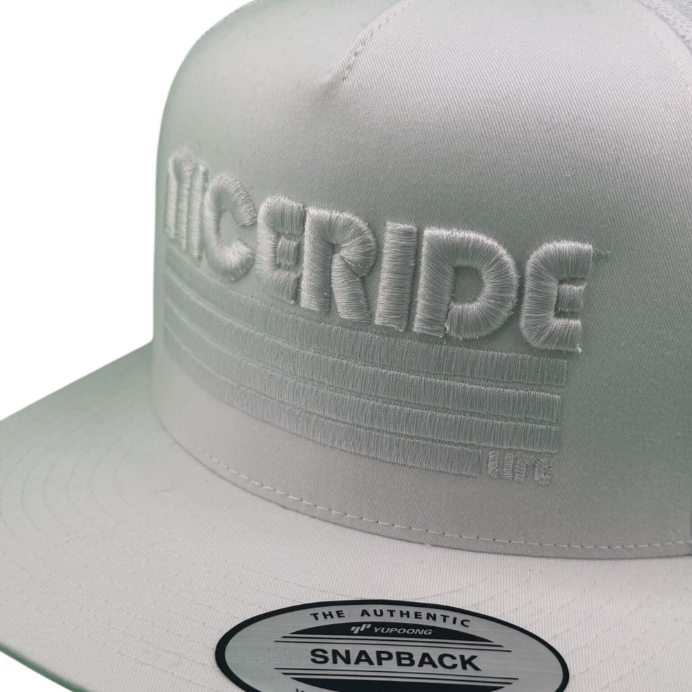 "Trigger" 3D Puff unisex adjustable trucker hat featuring NICERIDE embroidered design in white.