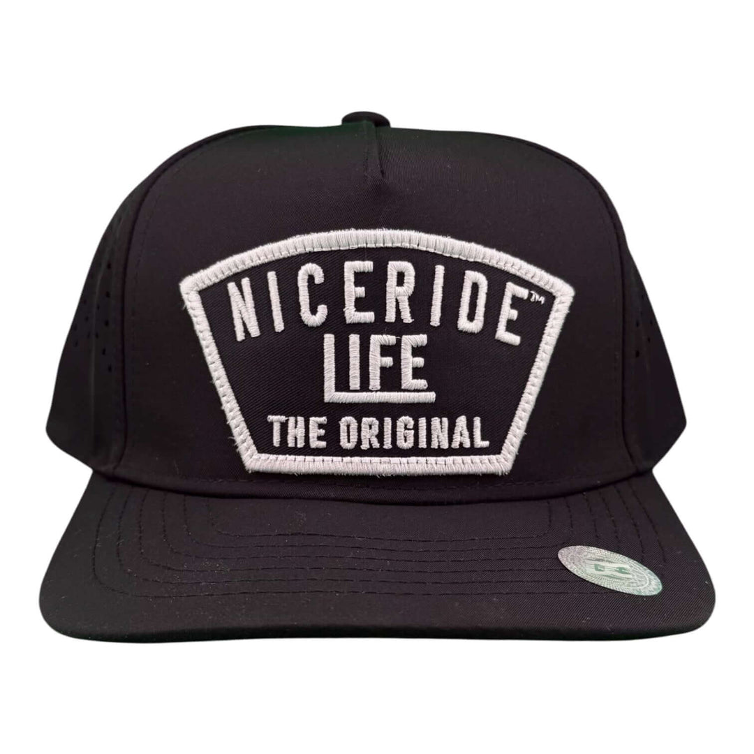 NICERIDE "Grinder" cap featuring waterproof A-Frame snapback and laser-cut mesh back for performance golf enthusiasts.