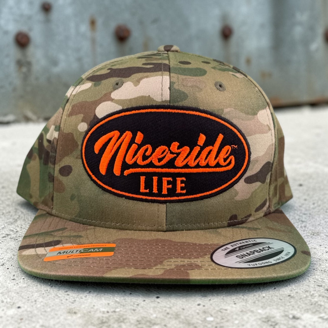 Unisex adjustable multicam trucker hat featuring NICERIDE logo, designed for style and comfort, perfect for all seasons.