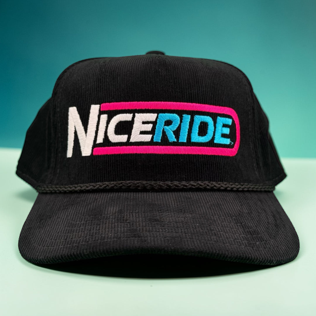 THE TUBE Corduroy cap featuring a colorful NiceRide logo, perfect for outdoor adventures and street style.