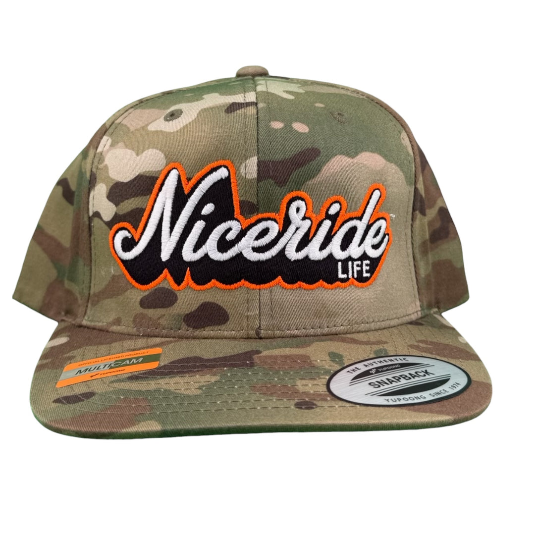 HALF PIPE 6089 Unisex Adjustable Multicam Trucker Hat with NICERIDE embroidered logo in orange on camo design.
