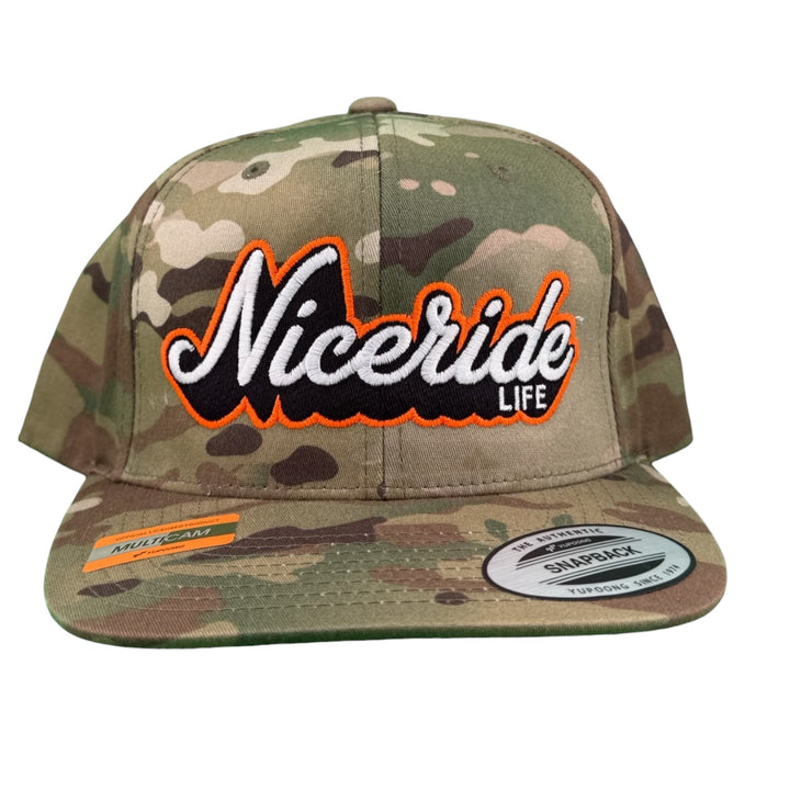 HALF PIPE 6089 Unisex Adjustable Multicam Trucker Hat with NICERIDE embroidered logo in orange on camo design.
