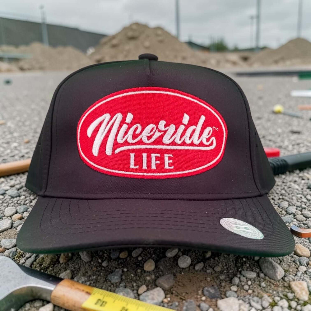 NICERIDE embroidered cap featuring bold red logo on black background, perfect for outdoor adventures and everyday wear.