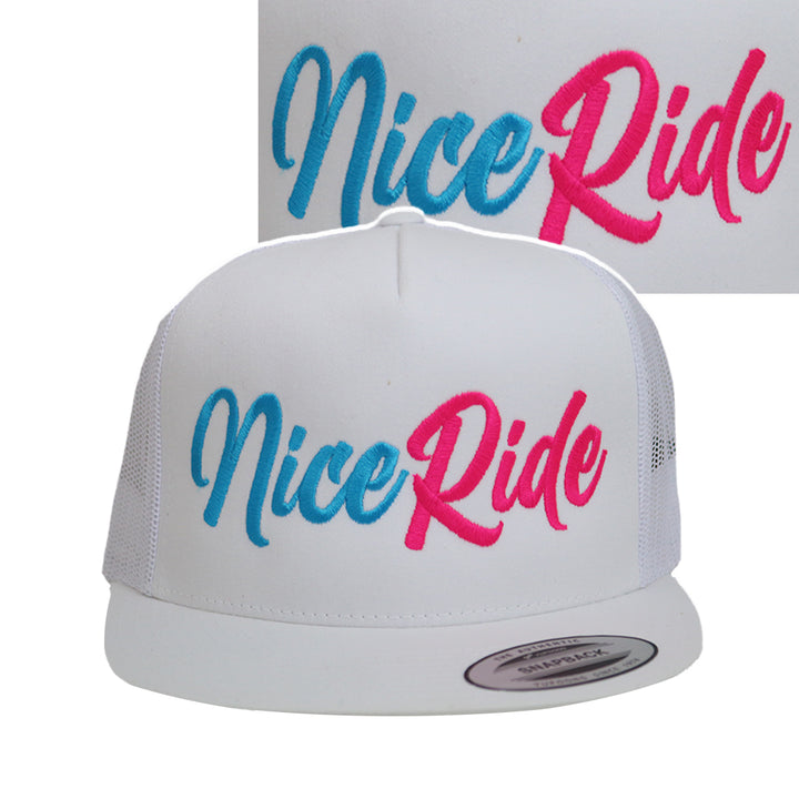 NICERIDE Signature adjustable unisex trucker hat with vibrant blue and pink embroidered logo on a white meshback cap.