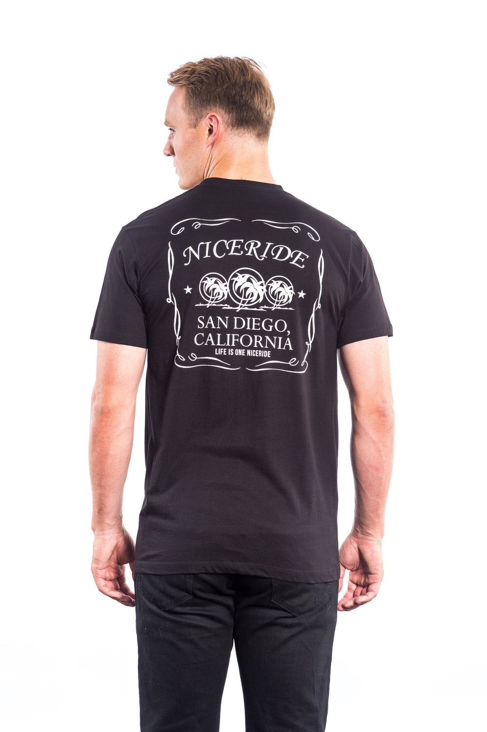 Back view of The Good Life men's shirt featuring NICERIDE design and San Diego, California text on a black cotton tee.
