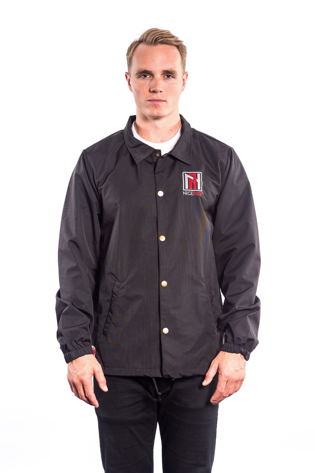 Model wearing N-R Windbreaker Jacket with logo on front, showcasing waterproof material and drawstring closure.