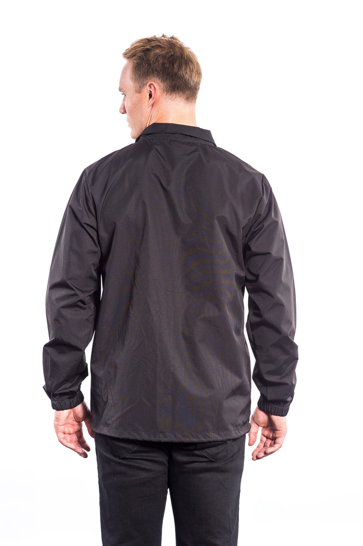 Back view of a man wearing the N-R Windbreaker Jacket, showcasing its sleek design and standard fit.