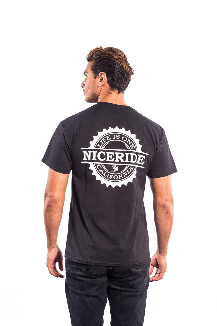 Back view of a man wearing a black shirt with NICERIDE graphic design, highlighting the unique style of the shirt.