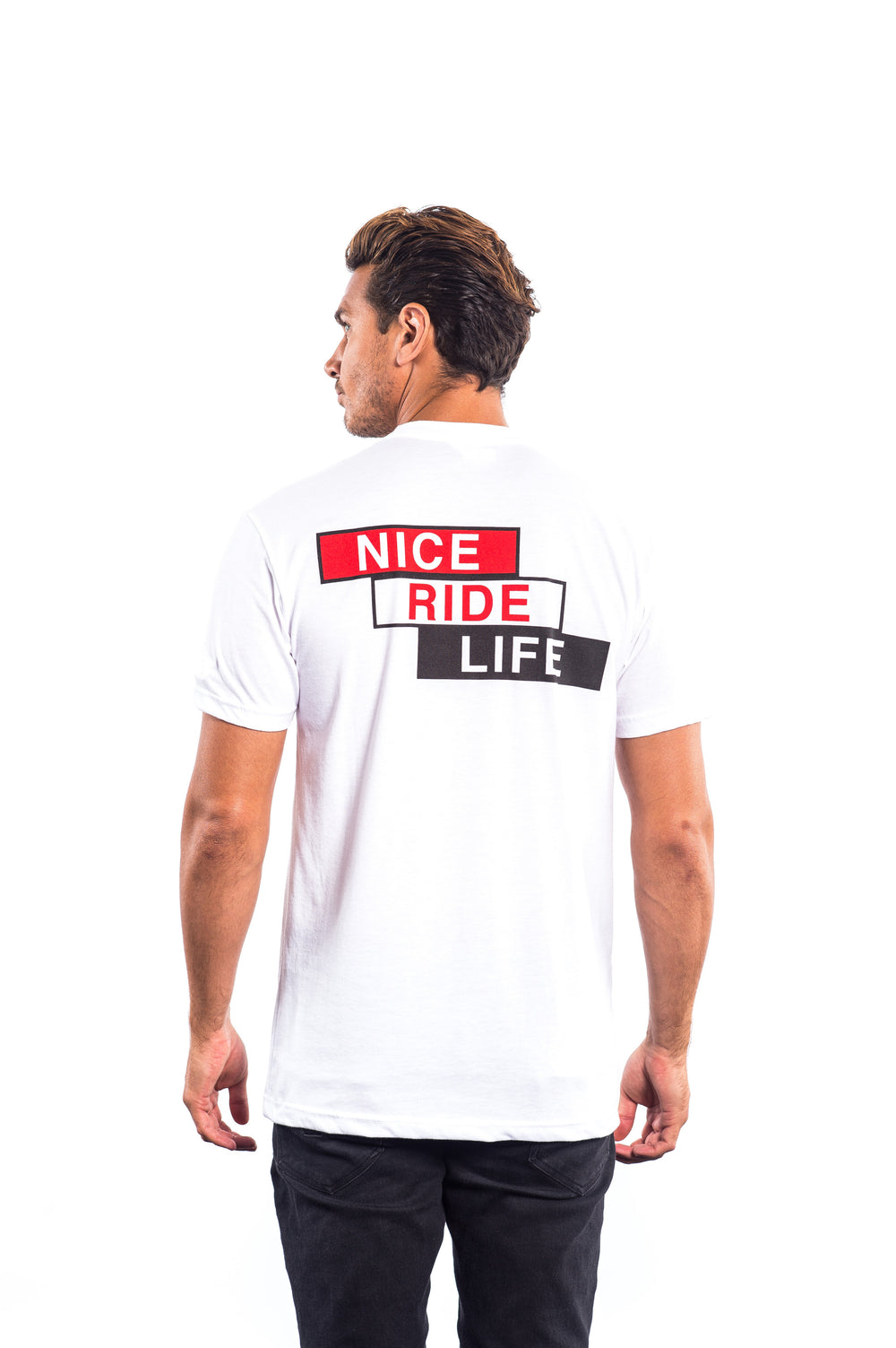 Back view of a man wearing a white shirt with 'NICE RIDE LIFE' graphic design on the back.
