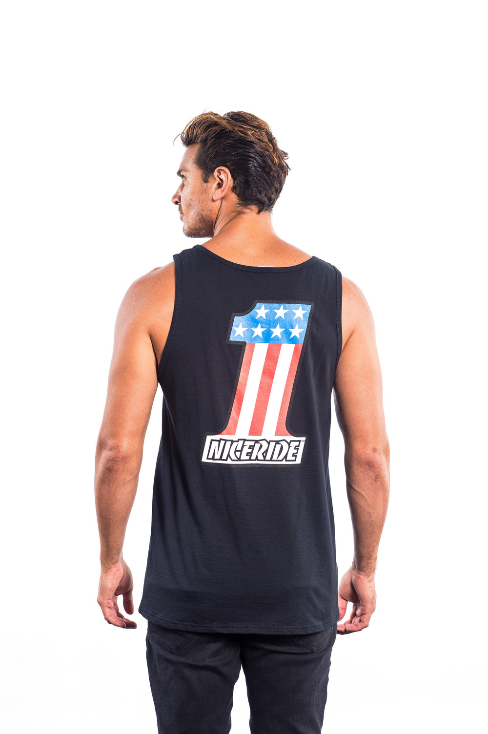 Man wearing a Nice Guns men's Fruit Of The Loom tank top shirt with a patriotic design on the back.