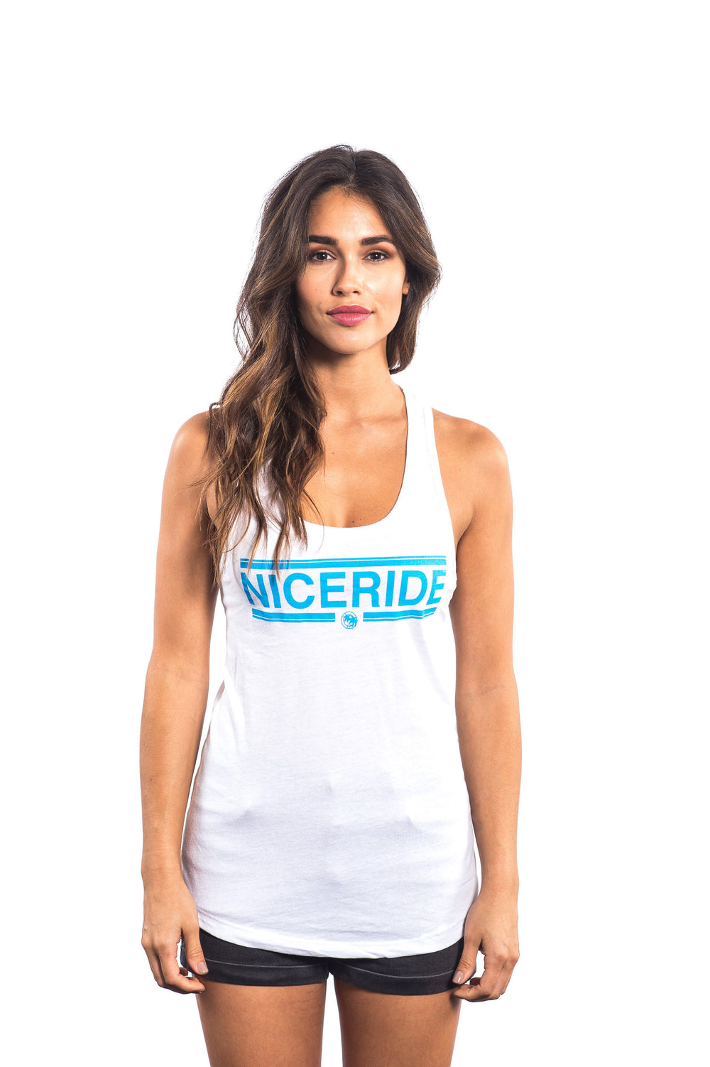 Woman wearing the Solana white Next level Women's Racerback Tank Top featuring NICERIDE design.