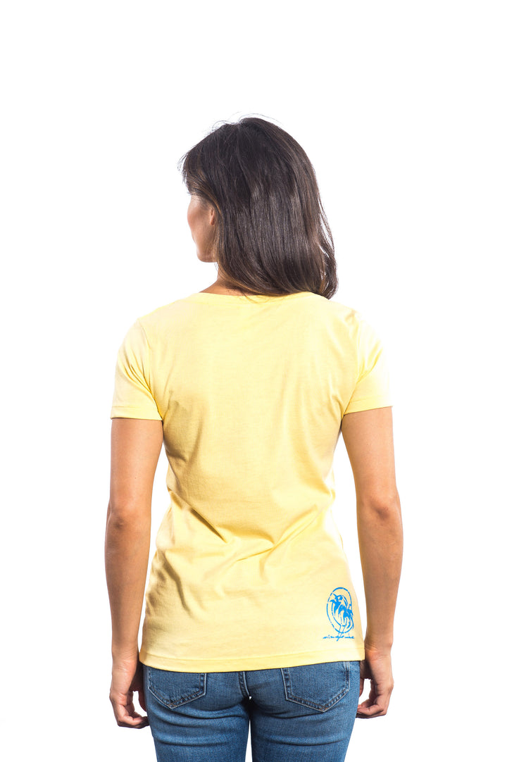 Back view of a woman wearing a yellow Next Level Women&