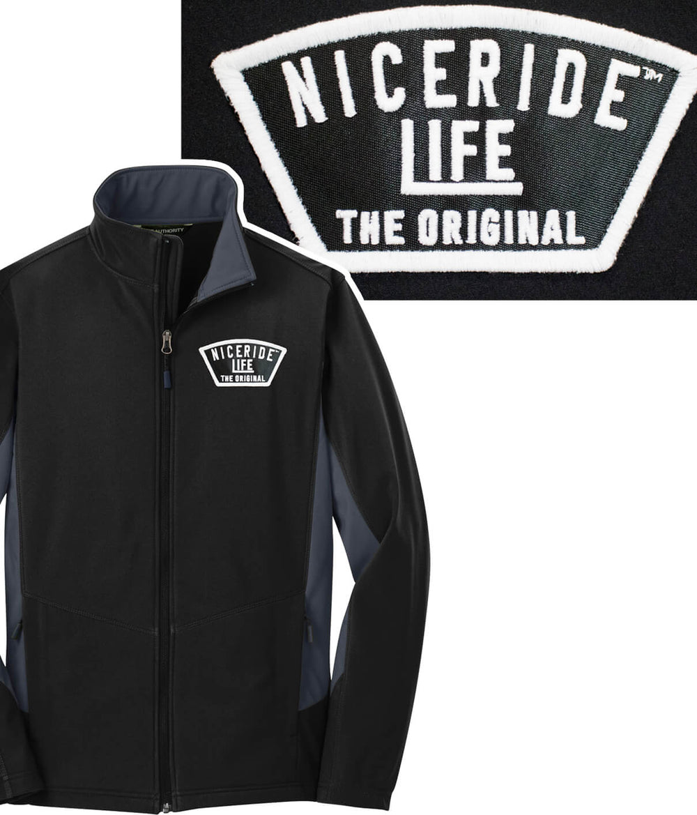 Grinder Evening Glow soft shell jacket featuring NICERIDE logo and glow in the dark thread patch.