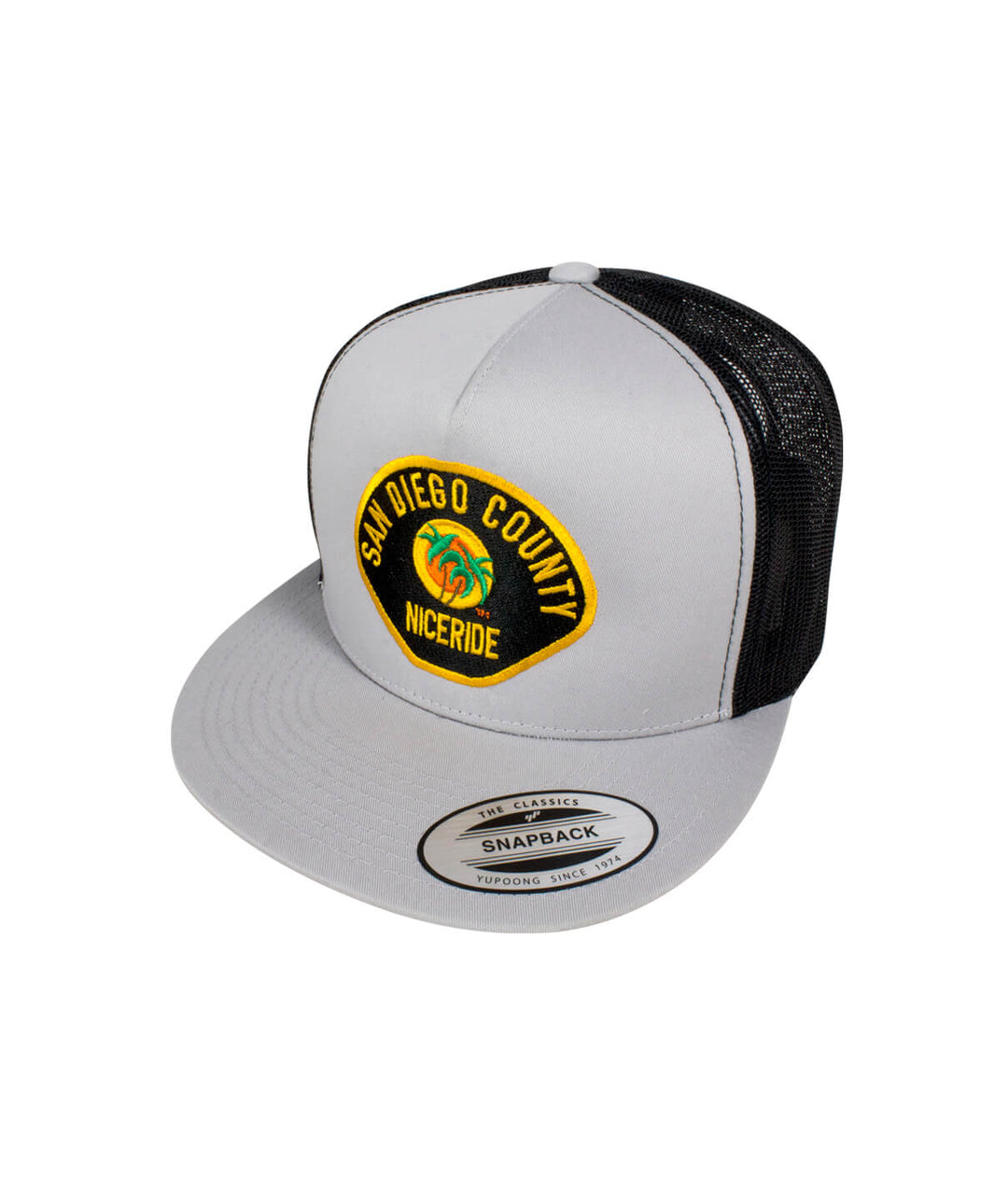 The Badge hat featuring San Diego County NICERIDE embroidered design on a gray snapback trucker cap.