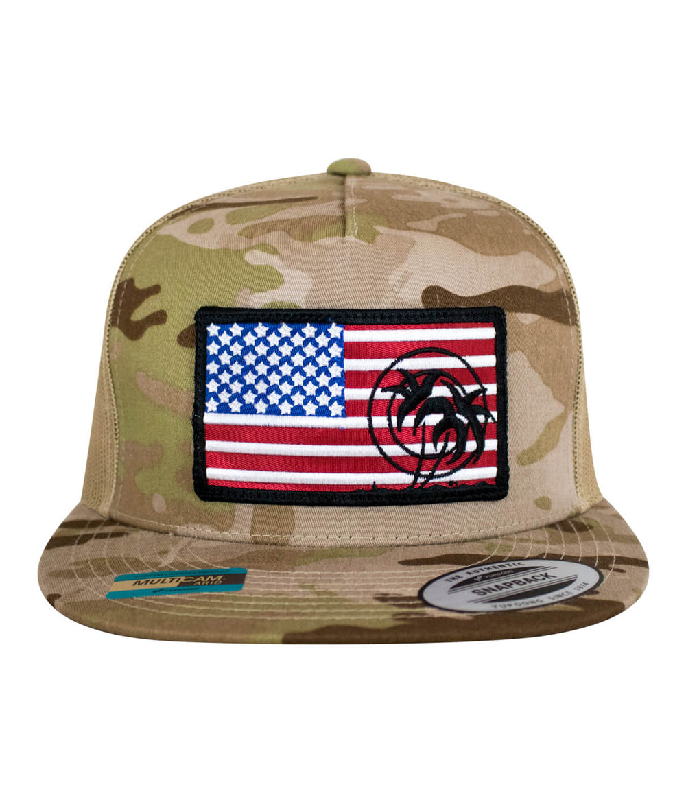 Camo snapback hat featuring embroidered American flag and palm tree design on front panel.