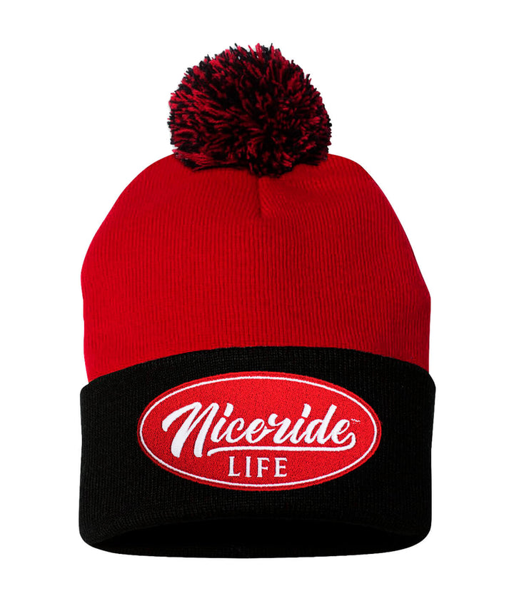Horsepower Puff Beanie featuring NICERIDE logo, red with black cuff, and pom-pom on top.