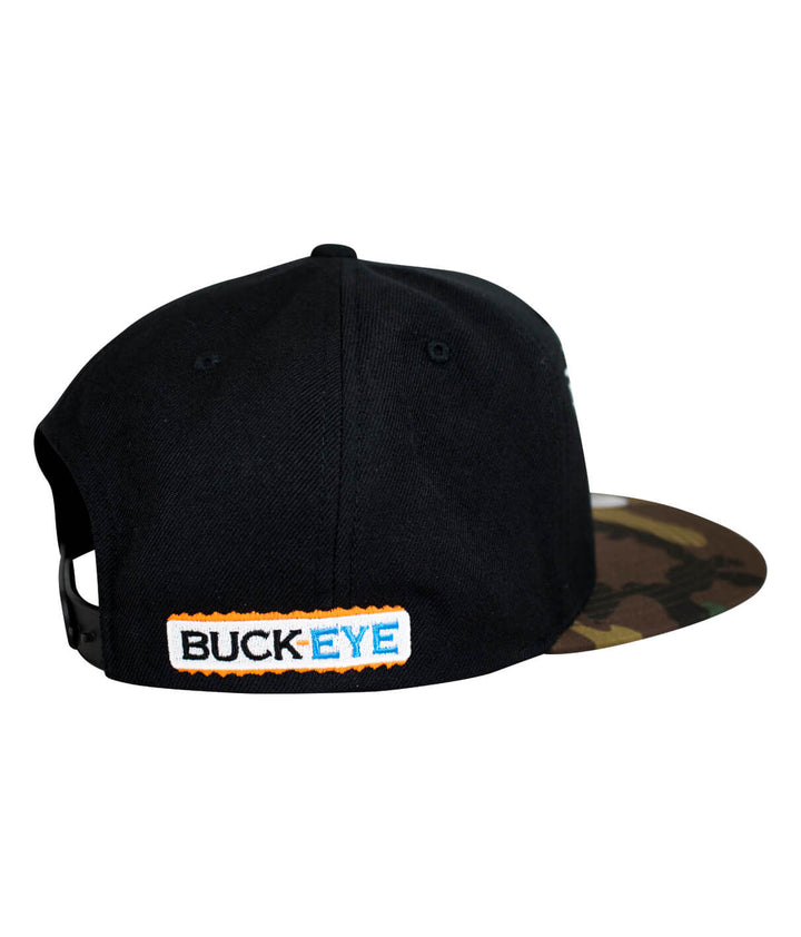Rear view of "BUCK-EYE FADED GLORY" snapback hat with black fabric and camo brim, featuring embroidered logo.
