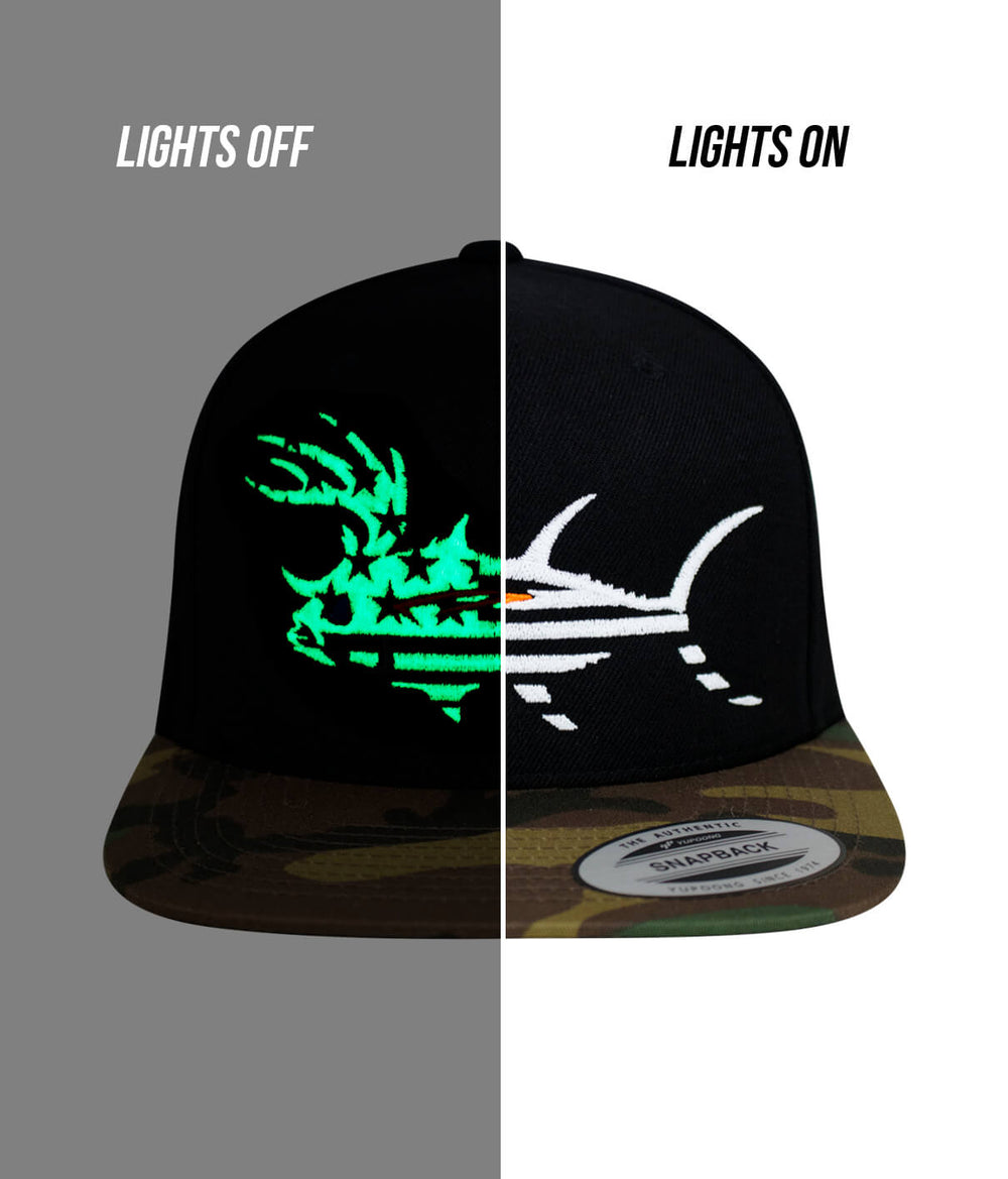 BUCK- EYE FADED GLORY hat displayed with lights off and lights on, showcasing the design on a unisex flatbill snapback cap.