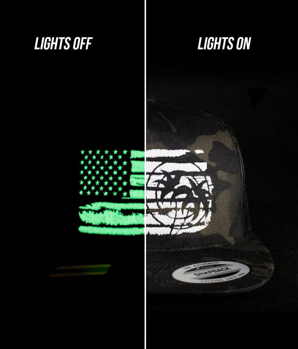 Strong Faded Trucker Hat showing glow-in-the-dark design of American flag and NICERIDE logo with lights off and on.