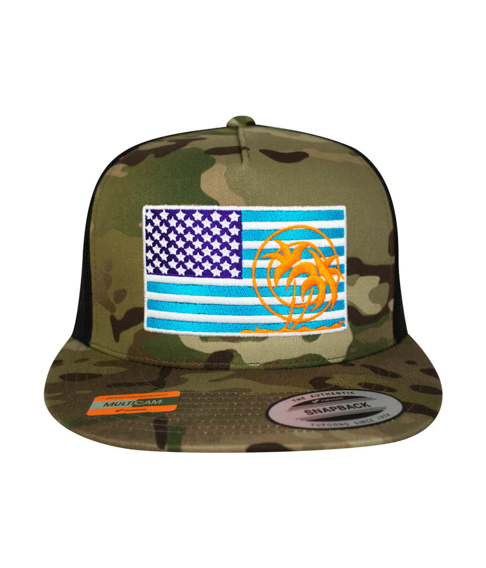 Pride Explorer hat featuring an American flag and palm logo on a camouflage trucker cap.