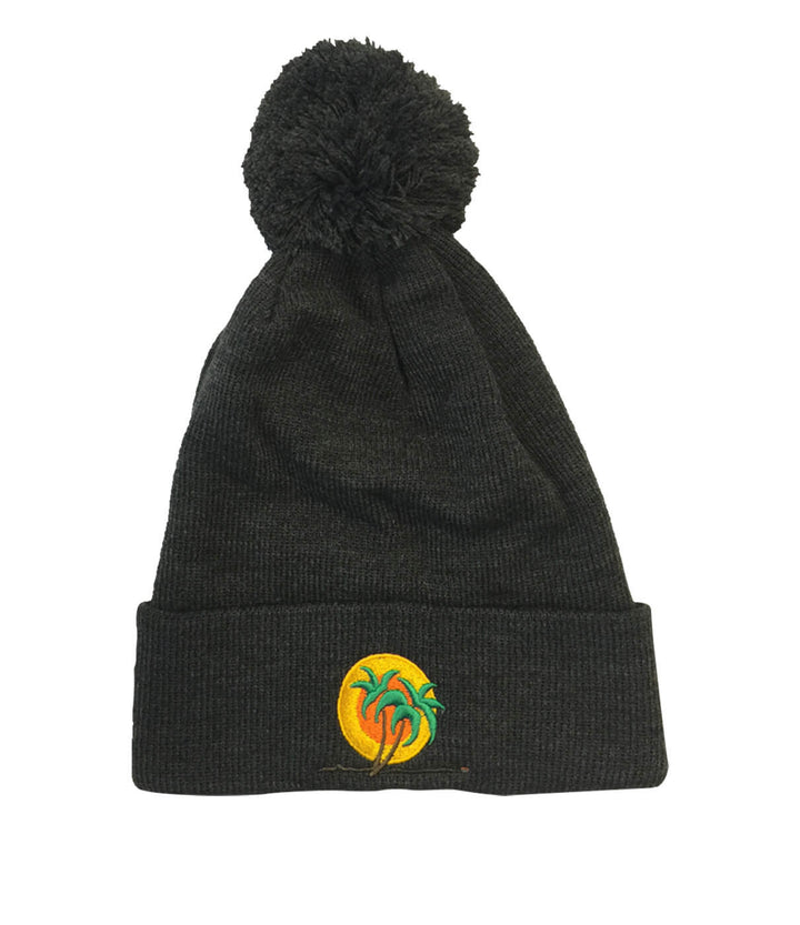 Classic Palm Puff Beanie featuring a pom pom and embroidered logo, perfect for style and warmth.