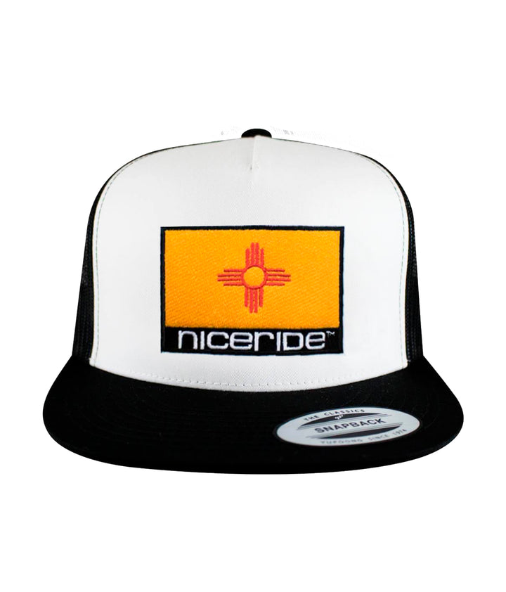 New Mexico Flag trucker hat with NICERIDE embroidery on front panel and palm logo on back.